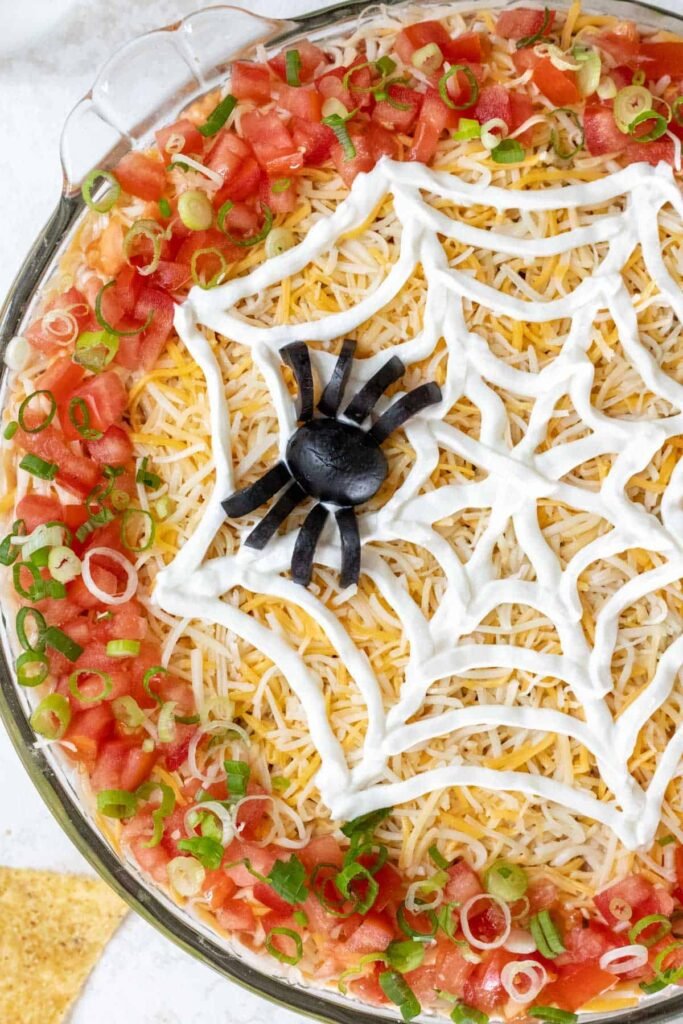 Spooky Halloween Spiderweb Taco Dip