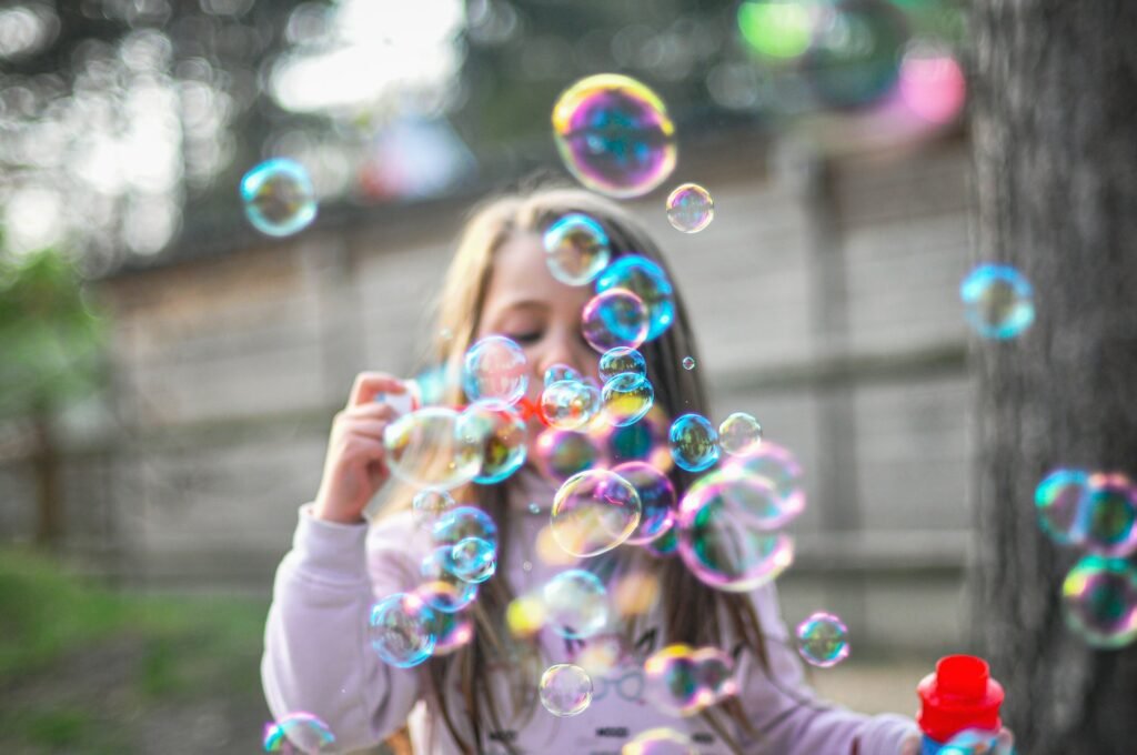 Kid blowing bubbles