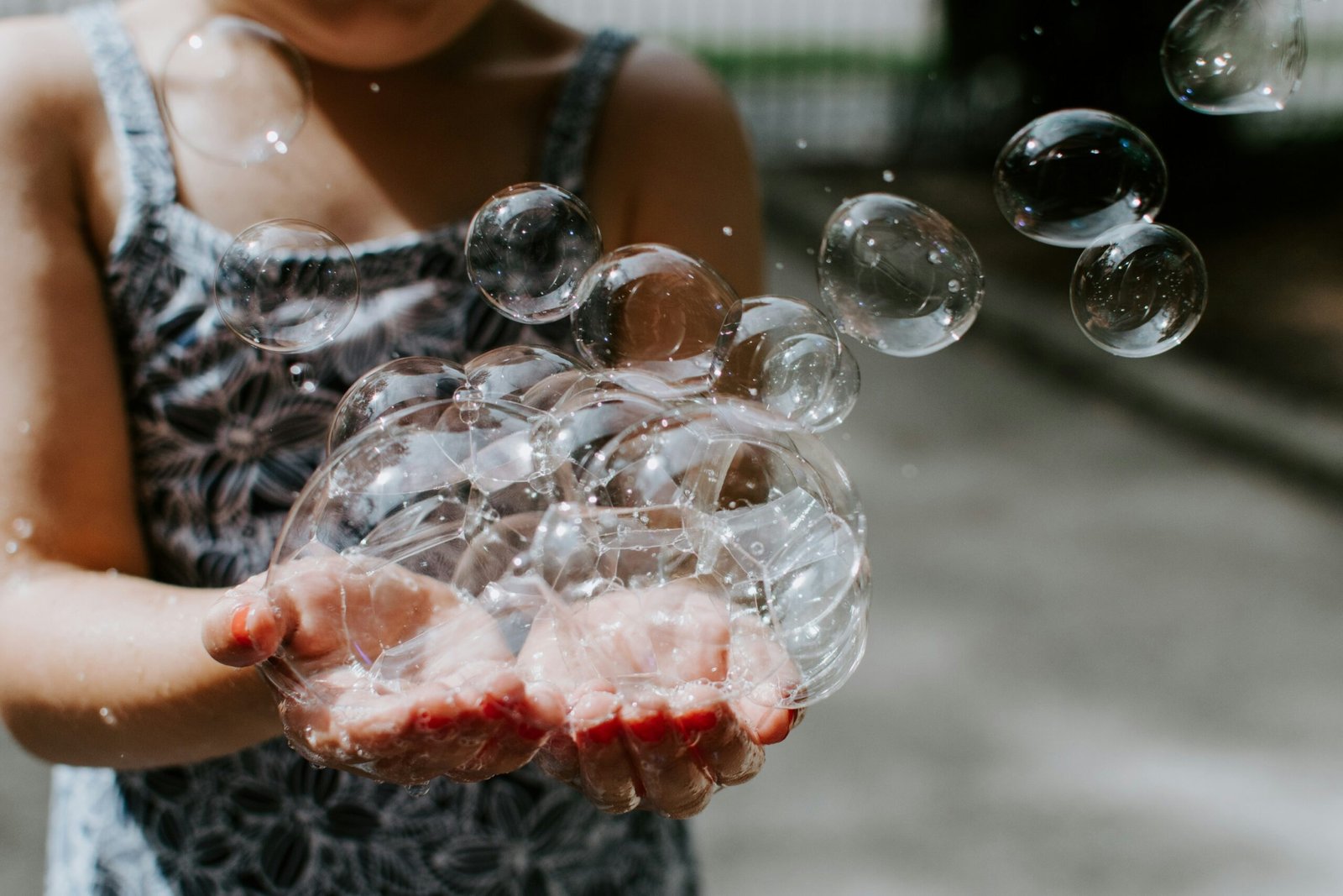 Kid playing with soap bubbles