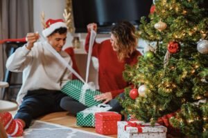Couple opening Christmas gifts